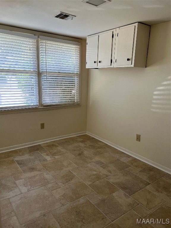 unfurnished room with a wealth of natural light