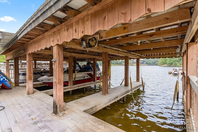 view of dock featuring a water view and boat lift