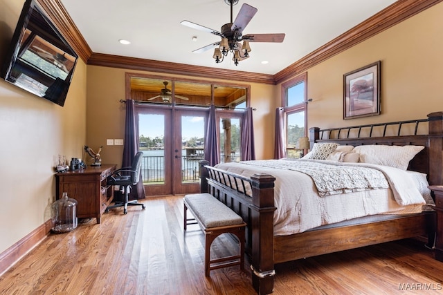 bedroom with access to exterior, crown molding, baseboards, and wood finished floors