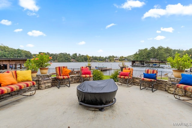 view of patio with a water view and outdoor lounge area