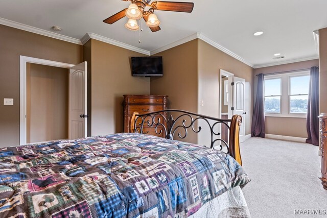 bedroom featuring a ceiling fan, light colored carpet, crown molding, and baseboards