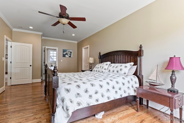 bedroom with ceiling fan, recessed lighting, wood finished floors, baseboards, and crown molding