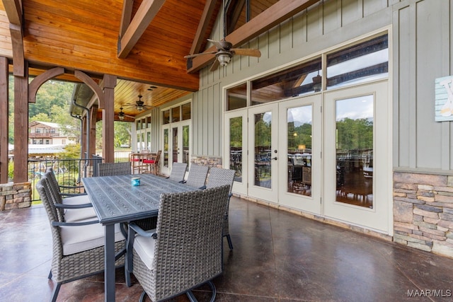 view of patio / terrace with outdoor dining space, ceiling fan, and french doors