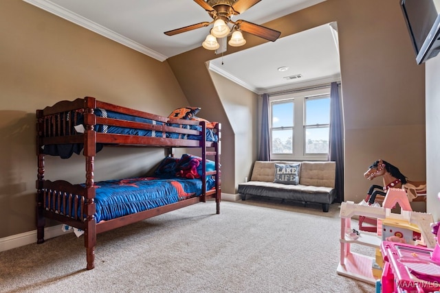 bedroom with visible vents, baseboards, ornamental molding, carpet flooring, and a ceiling fan