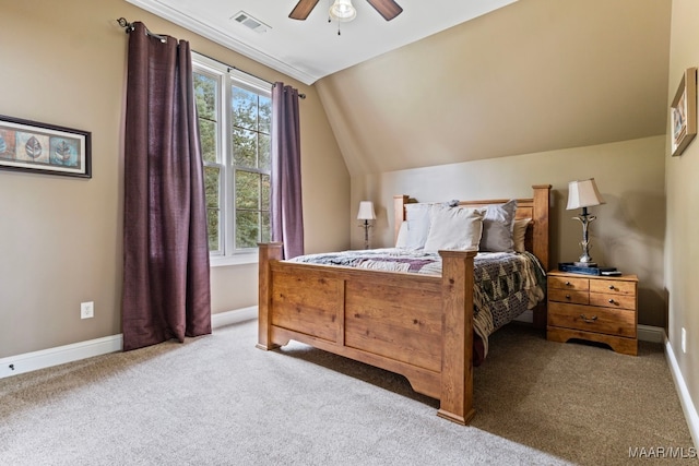 bedroom featuring lofted ceiling, light colored carpet, visible vents, and baseboards