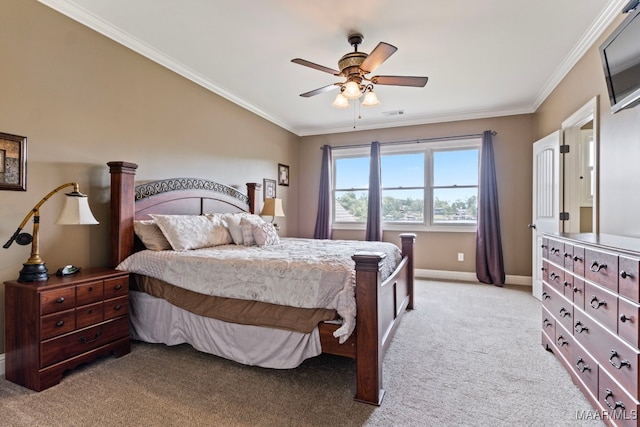 bedroom with light colored carpet, visible vents, baseboards, a ceiling fan, and crown molding