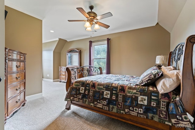 bedroom featuring light carpet, baseboards, a ceiling fan, vaulted ceiling, and crown molding