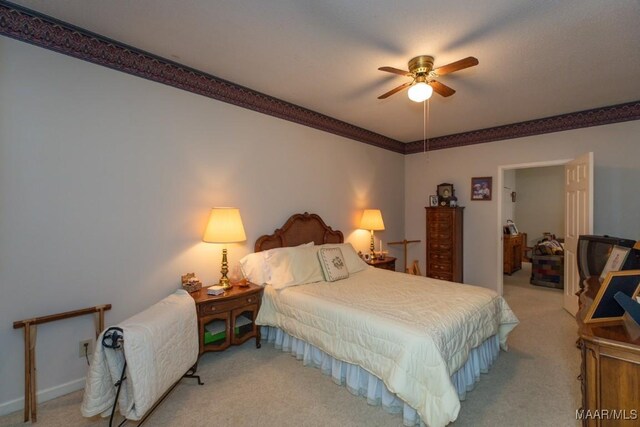 bedroom with ceiling fan and carpet flooring