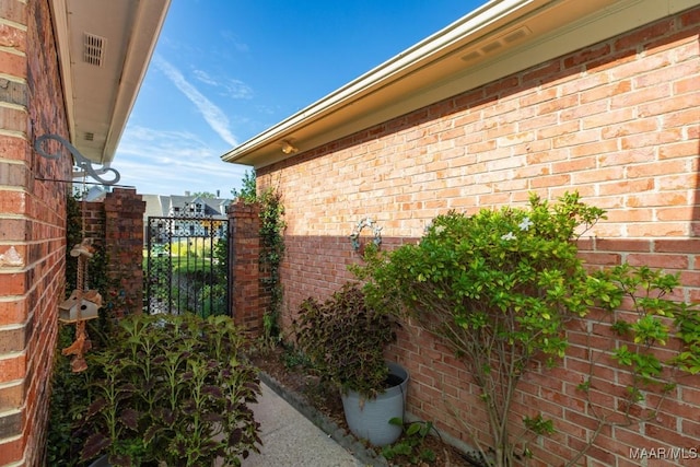 view of property exterior with brick siding