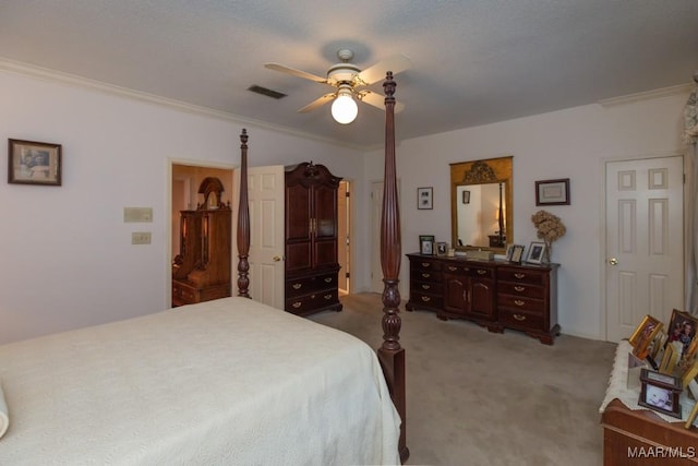 bedroom featuring visible vents, crown molding, light carpet, and ceiling fan