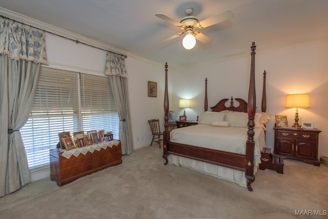 bedroom with crown molding, ceiling fan, and light carpet