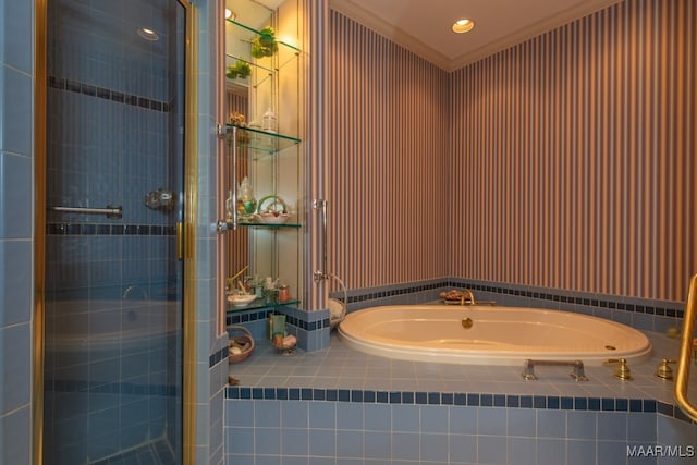 full bath featuring a stall shower, ornamental molding, and a bath