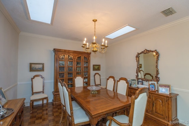 dining area featuring a chandelier, a skylight, visible vents, and crown molding