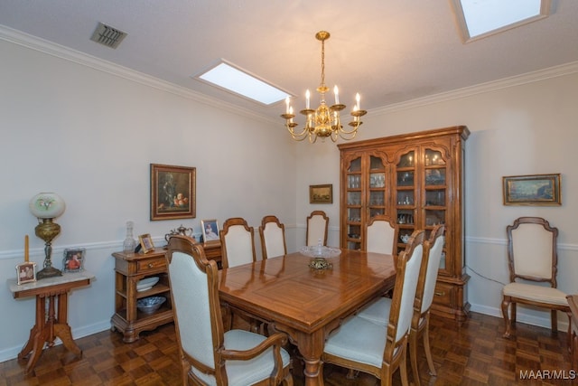 dining room with dark parquet floors, a chandelier, and crown molding