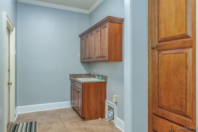 interior space featuring light tile patterned floors, crown molding, and sink