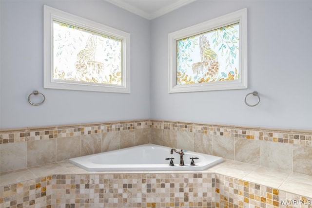 bathroom featuring tiled tub and ornamental molding