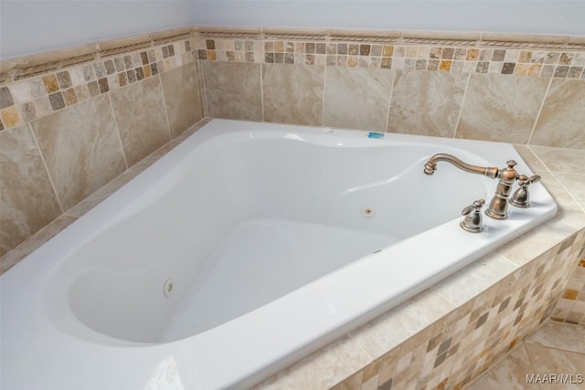 bathroom with tiled tub