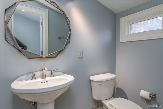 bathroom with toilet and sink