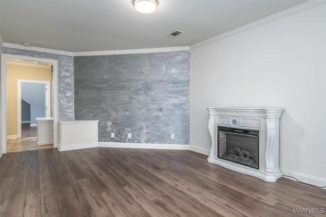 unfurnished living room with dark hardwood / wood-style floors and ornamental molding