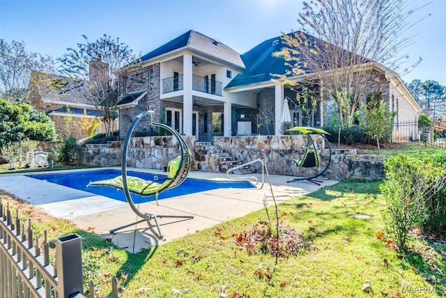 exterior space featuring a lawn, a patio area, and ceiling fan