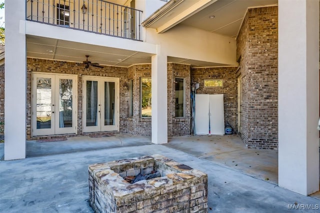 view of patio featuring french doors, a balcony, and ceiling fan