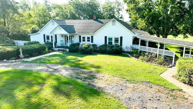 single story home with covered porch and a front yard