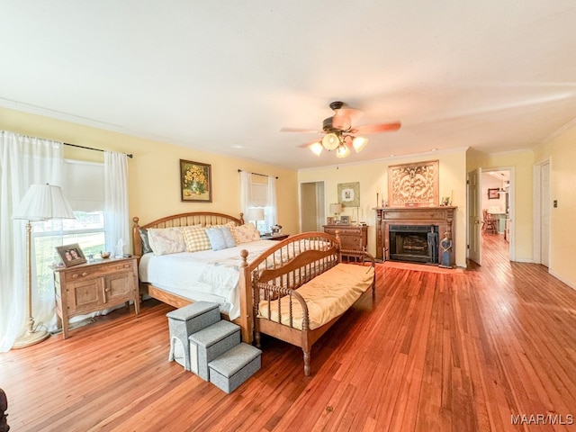 bedroom with ceiling fan and hardwood / wood-style floors