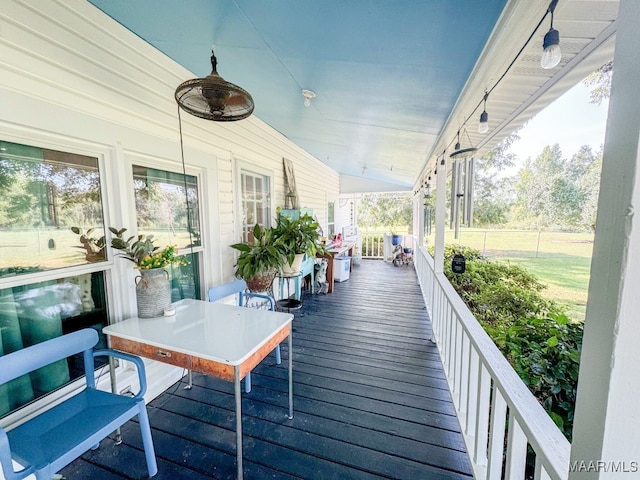 wooden deck with ceiling fan