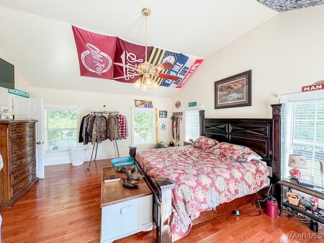 bedroom featuring lofted ceiling and hardwood / wood-style floors