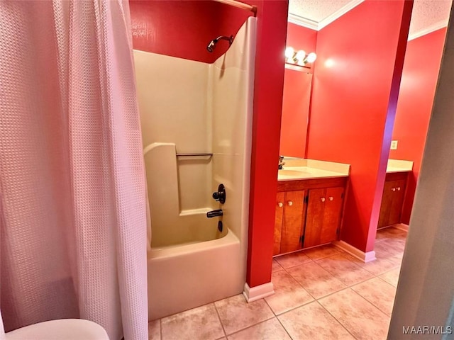 full bath with tile patterned flooring, vanity, baseboards, shower / bath combo with shower curtain, and crown molding