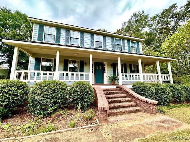 colonial house featuring a porch