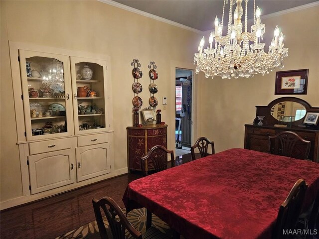 dining space with crown molding, dark wood-type flooring, and an inviting chandelier