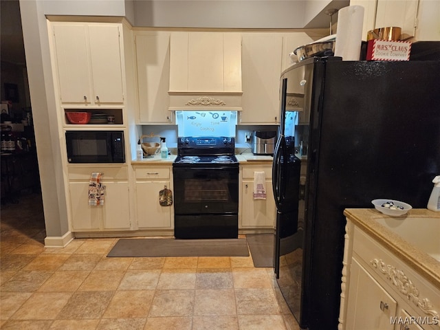 kitchen featuring black appliances and white cabinets