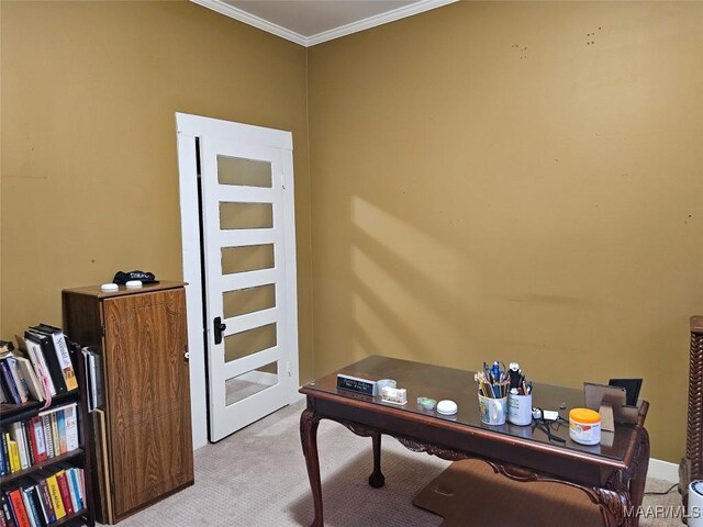 carpeted home office featuring crown molding