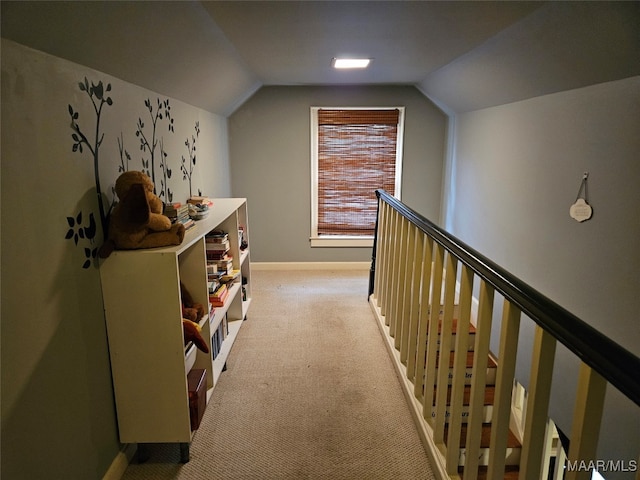 interior space featuring light carpet and lofted ceiling