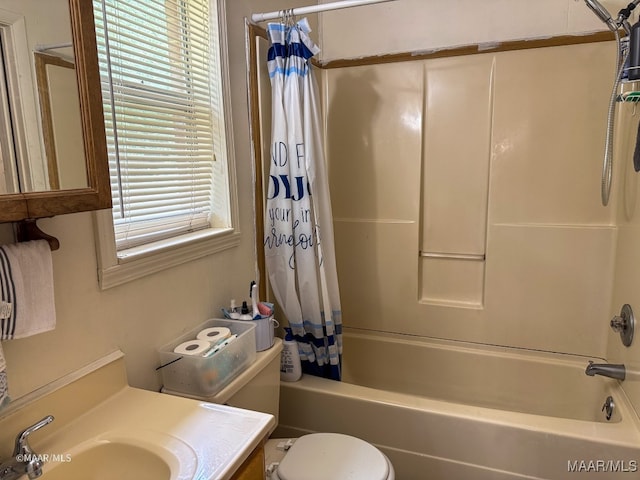 full bathroom featuring vanity, toilet, and shower / bath combination with curtain