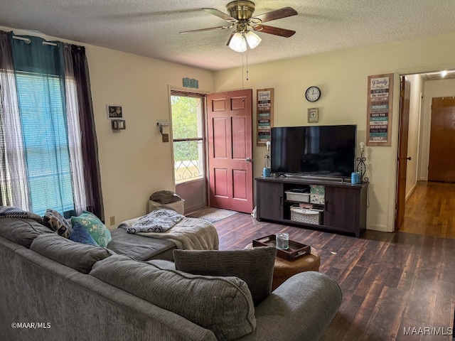 living room with a textured ceiling, ceiling fan, and hardwood / wood-style floors