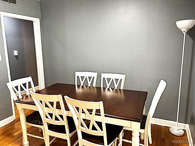 dining area featuring hardwood / wood-style floors