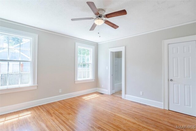 2056 Gorgas St, Montgomery, AL 36106 - unfurnished bedroom with multiple windows, light wood-style floors, and baseboards