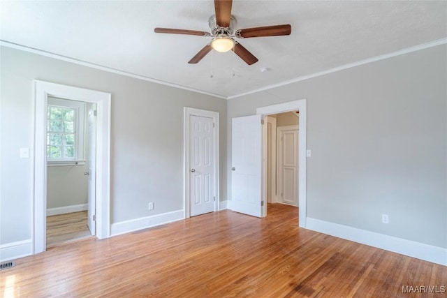 2056 Gorgas St, Montgomery, AL 36106 - unfurnished bedroom featuring visible vents, light wood-style flooring, a ceiling fan, crown molding, and baseboards
