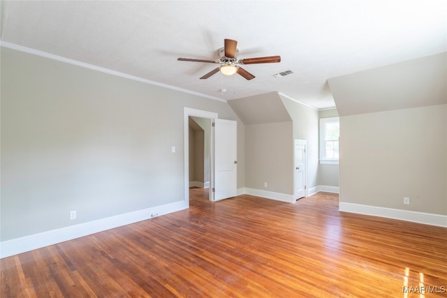 additional living space featuring ceiling fan, wood-type flooring, and vaulted ceiling