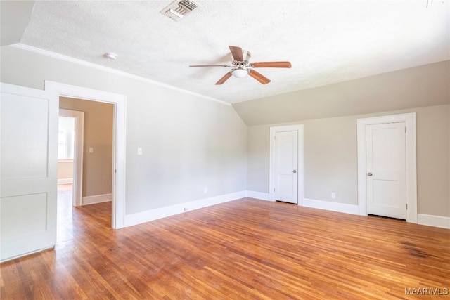 2056 Gorgas St, Montgomery, AL 36106 - unfurnished room featuring a ceiling fan, visible vents, baseboards, light wood-style flooring, and vaulted ceiling