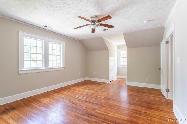 2056 Gorgas St, Montgomery, AL 36106 - additional living space featuring ceiling fan, visible vents, wood finished floors, and vaulted ceiling
