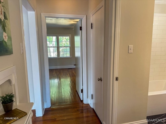 hallway with dark wood-type flooring