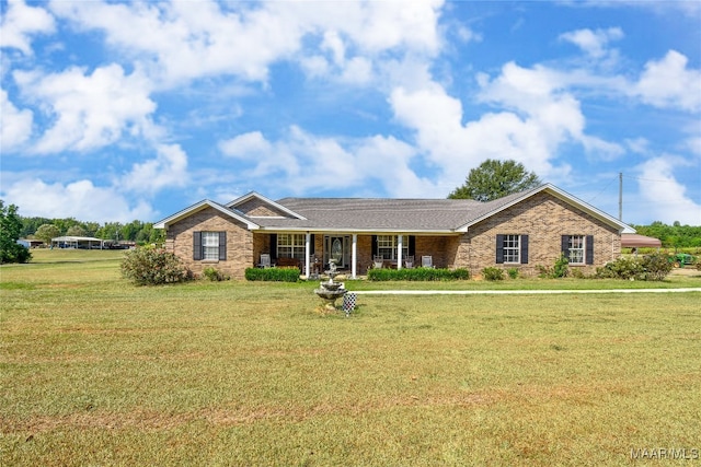 ranch-style house featuring a front lawn