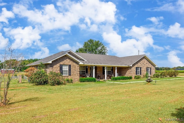 145 Cotton Ln, Deatsville, AL 36022 - single story home featuring covered porch, a front lawn, and brick siding
