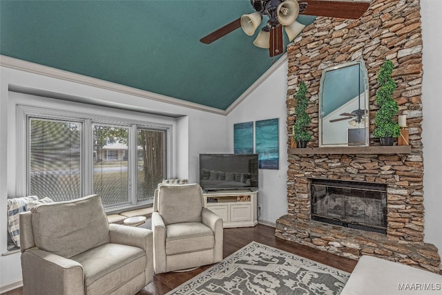 living room with a stone fireplace, dark hardwood / wood-style flooring, ceiling fan, and high vaulted ceiling