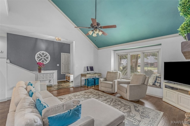 living room featuring ceiling fan, ornamental molding, dark wood-type flooring, and high vaulted ceiling