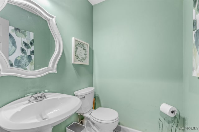 bathroom featuring sink and toilet