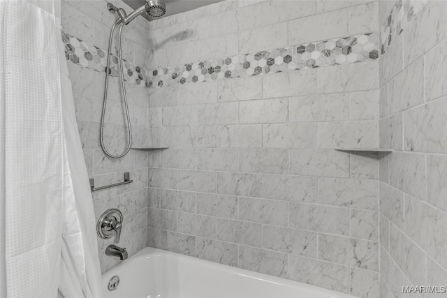 bathroom featuring shower / bath combo with shower curtain